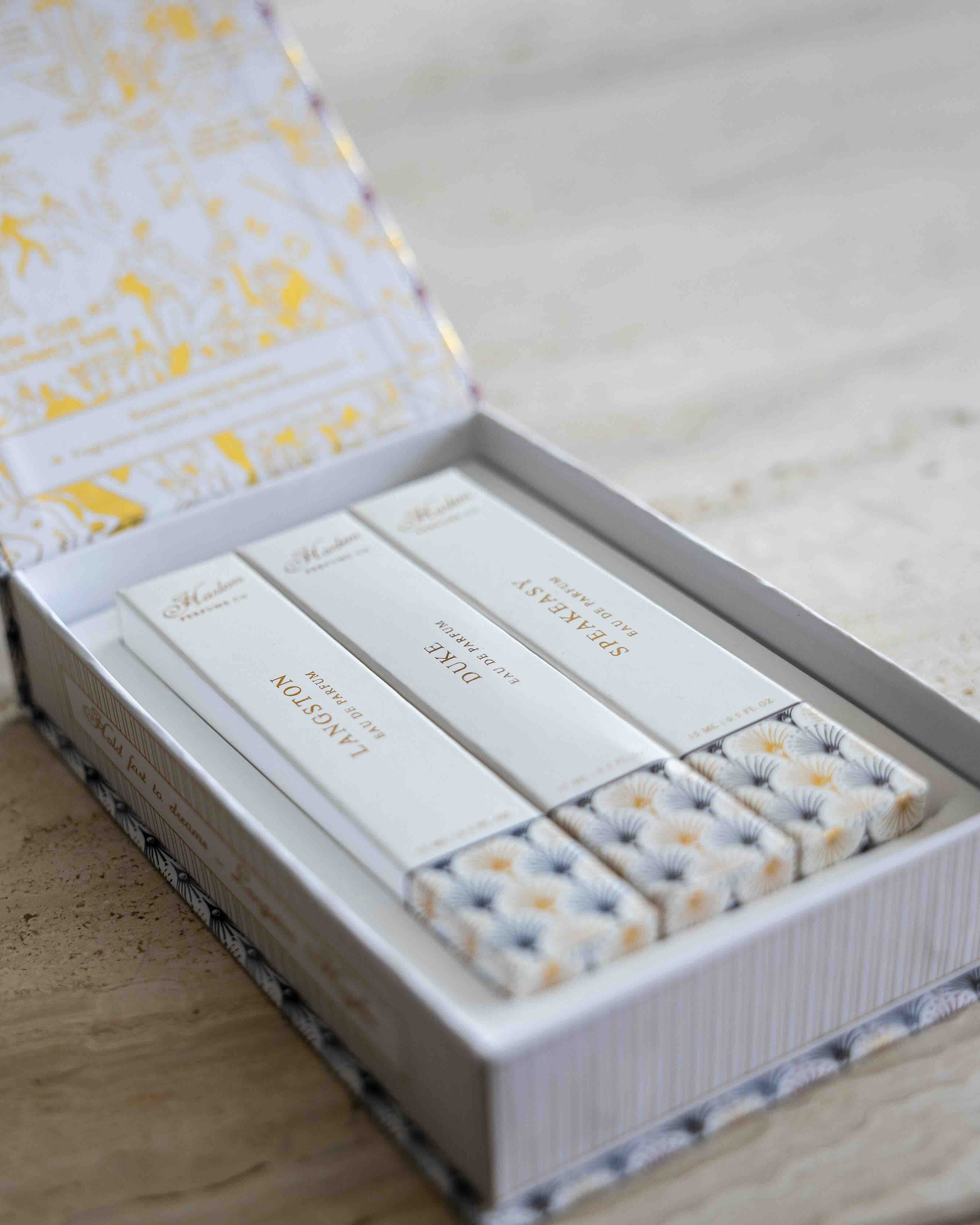 This is a lifestyle image of the perfume discovery box that contains the Langston, Duke and Speakeasy fragrances.