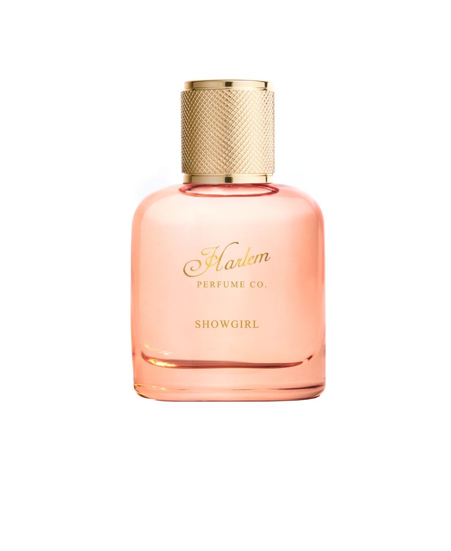 Showgirl perfume bottle in blush pink glass with textured gold cap