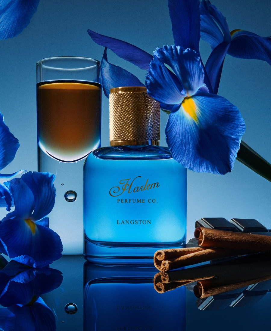 this is an image of our Langston light blue bottle with cinnamon and orris surrounding it.