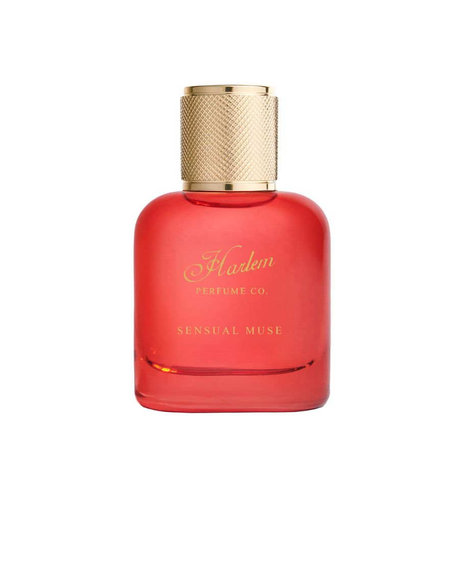 Red perfume bottle with gold cap on a white background